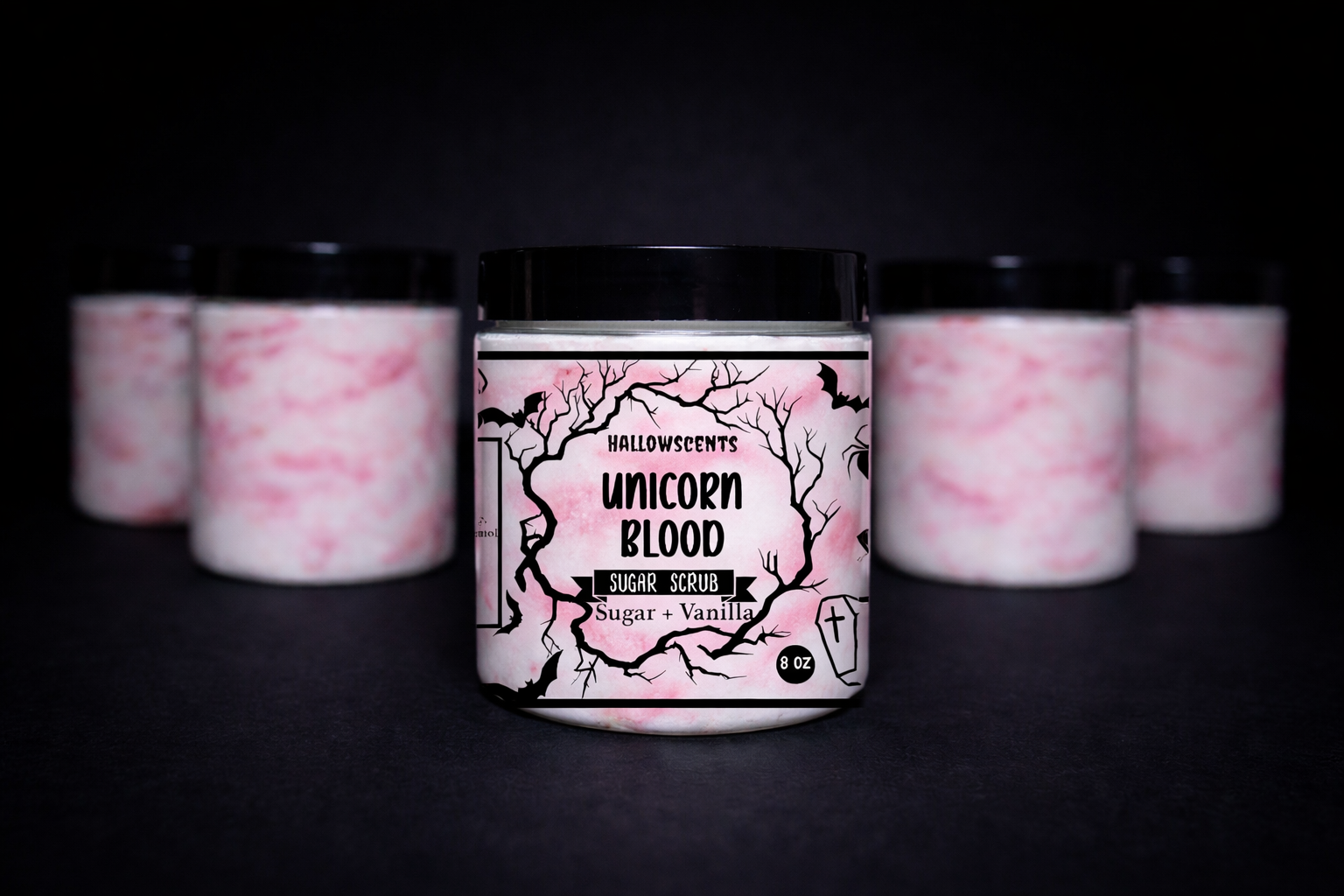 Jar of 'Unicorn Blood' sugar scrub with pink and white marbled design on a black background
Horror Wax Bars. Horror Candles. Spooky Wax Bars. Horror Candles. Horror Bath and Body. Spooky bath and body. 